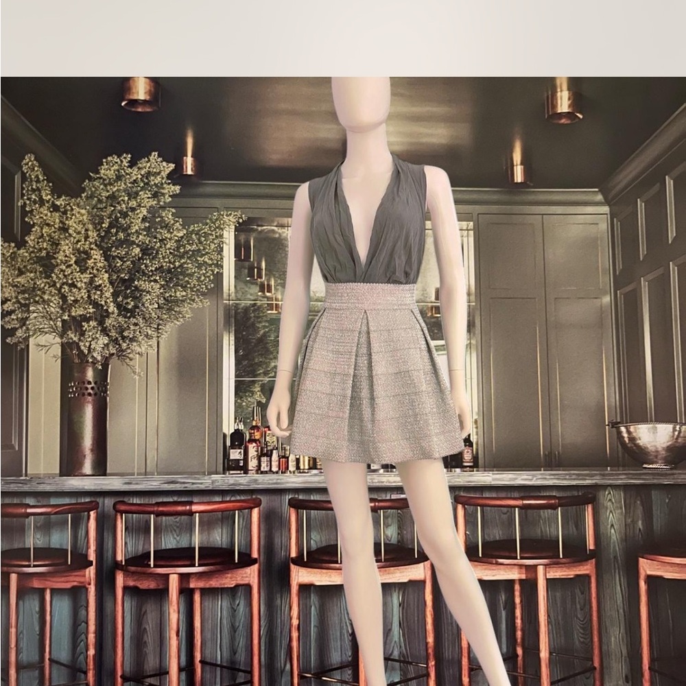 Devlin London metallic silver pleated skirt paired w/grey deep V top.